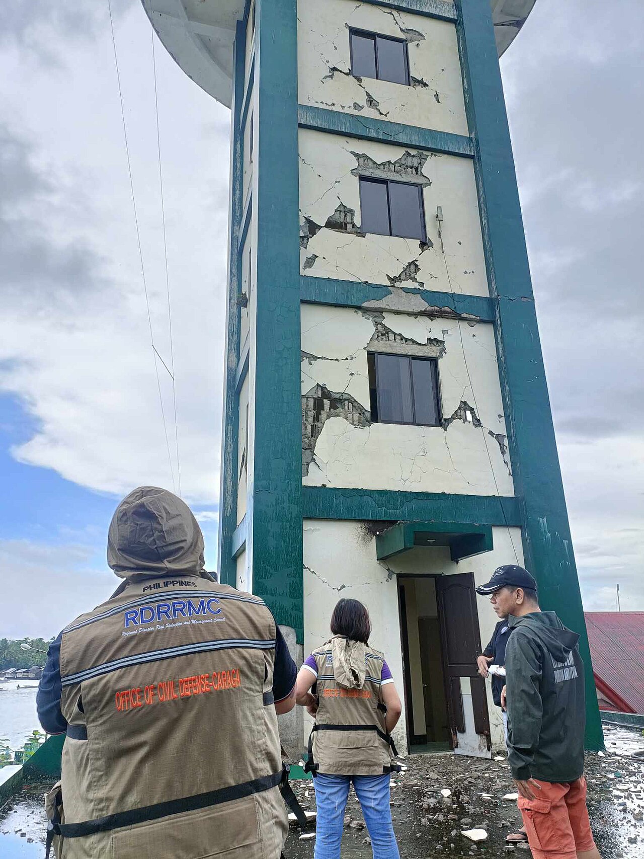 Archive photo from Hinatuan, Surigao del Sur: responders inspect a cracked PAGASA radar tower after the 2023 earthquake.